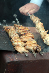 Chicken on the grill to cook
