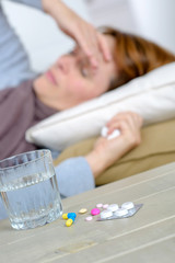 Obraz na płótnie Canvas Woman in bed with a headache