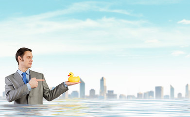 Fototapeta na wymiar Businessman with duck