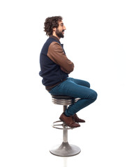 young man thinking with bar stool