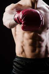 Muscular man in boxing concept
