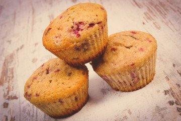 Vintage photo, Fresh baked muffins with raspberries, delicious dessert