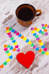 Cardiogram line of paper hearts and cup of coffee, medicine and healthcare concept