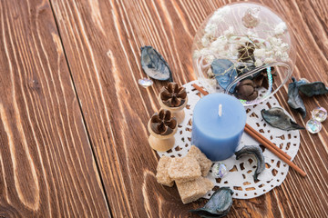 spa stuff on wooden background: candle, aroma