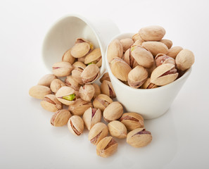 Heap of pistachios nuts isolated on the white