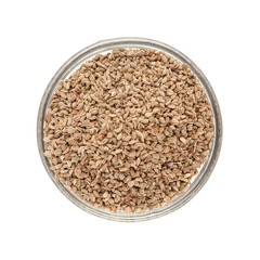 Top view of Organic Ajwain (Trachyspermum ammi) in glass bowl isolated on white background.