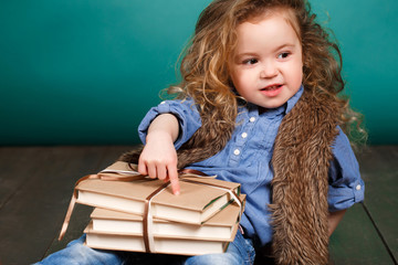 Little girl with books.