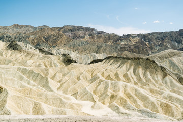 Dry and arid sand dune landscape of Death Valley National Park at Zabriskie point