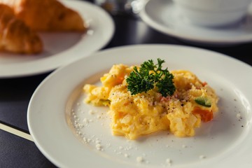 Omelets, breakfast served with coffee and croissants.