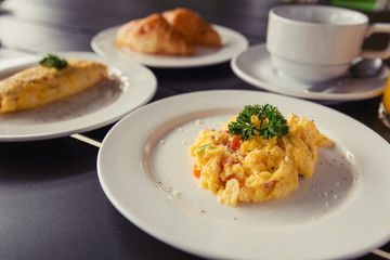 Omelets, breakfast served with coffee and croissants.