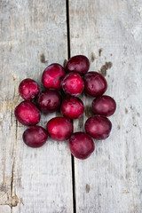 Sweet plums on wooden background
