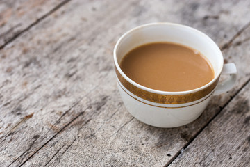 Vintage painted coffee cup on old wooden table