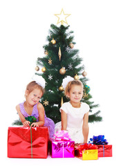 Sisters at Christmas tree