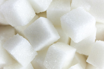 Close-up of Sugar Cubes in Square Shaped Bowl on Isolated White Background