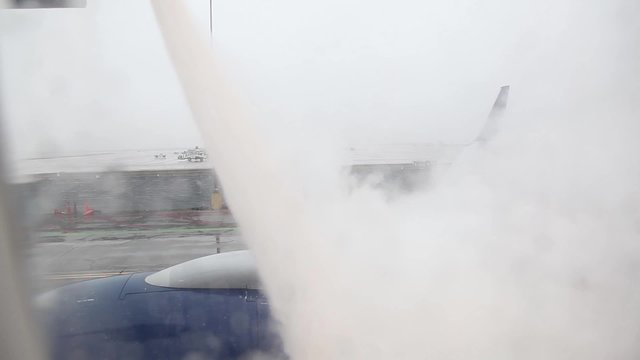 Deicing Plane Seen Through Window