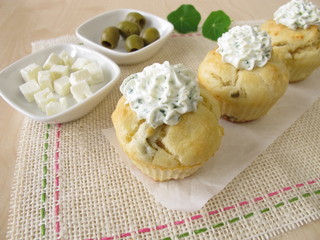 Cupcake with olives, feta cheese and herb cheese topping