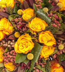 close up of yellow roses on the market