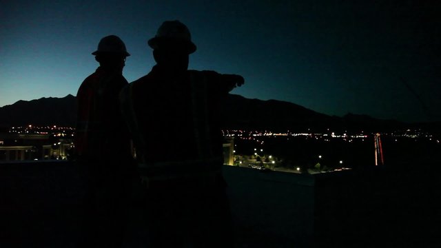 Surveying Construction Site at Dawn