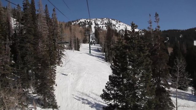 Riding a Ski Lift Towards Mountain Peak