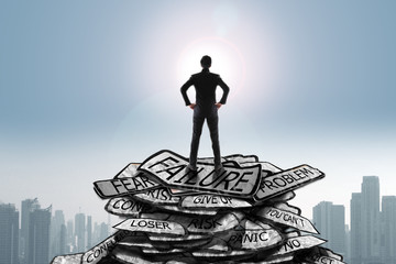 Businessman stand on problem traffic sign looking at sun, success concept