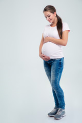 Pregnant woman caressing her belly