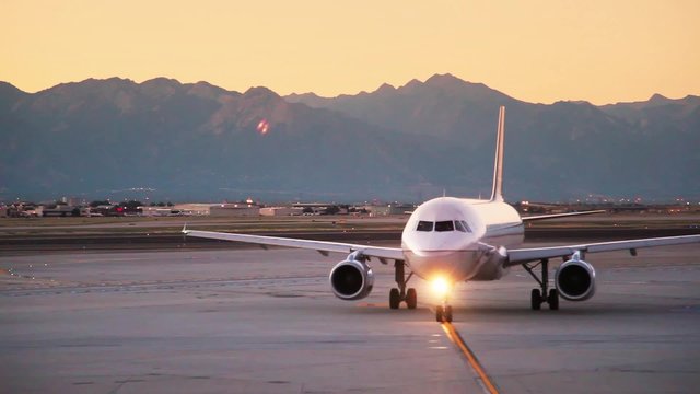 Plane Leaving at Sunrise Mountain Background