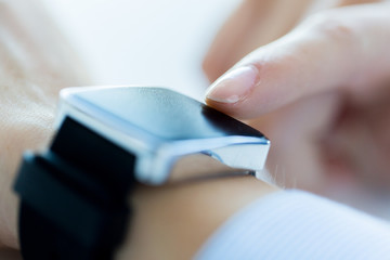 close up of hands setting smart watch