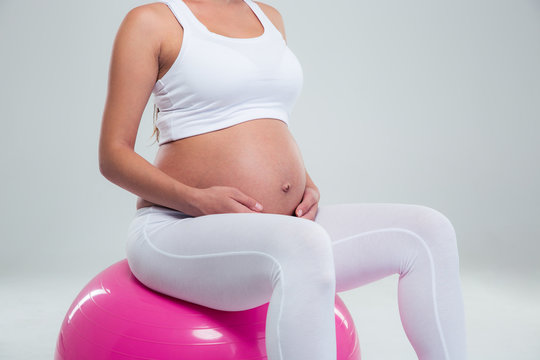 Pregnant Woman Sitting On A Fitness Ball