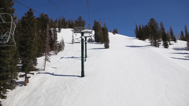 Riding a Ski Lift on a Sunny Day
