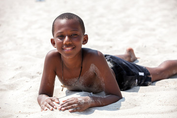 Portrait of a african boy on sand