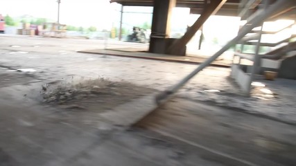 Construction Worker Scrapes Cement Glidecam Shot