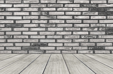 white brick wall and wooden plank