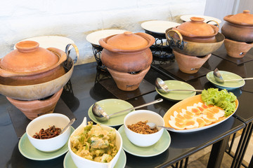 Old clay pot with on food and garnish