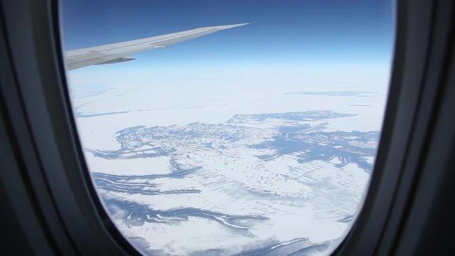 Frozen Tundra from Airplane Window
