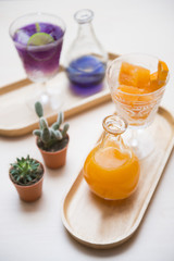 pea flower water and orange juice set for drink