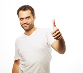 Naklejka premium Happy handsome man showing thumbs up 
