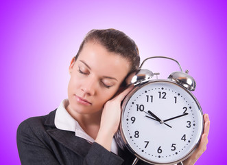 Woman with giant clock on white