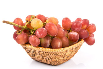A bunch of red grapes over white background