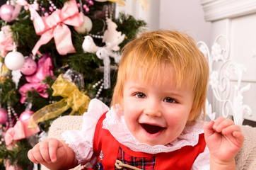 baby near christmas tree