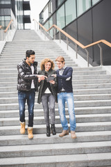 Obraz premium Multiracial business people working outdoor walking downstairs,