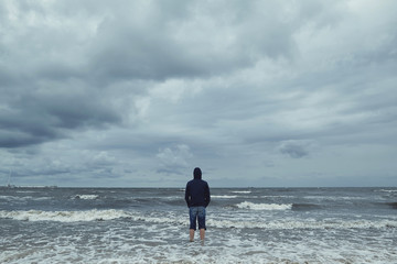 alone man on the beach