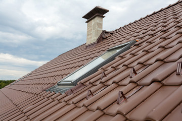 New roof with skylight, natural red tile and chimney