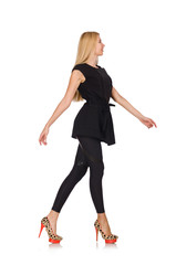 Pretty woman in tight black pants isolated on white