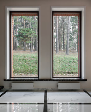 Interior of modern empty space with big windows