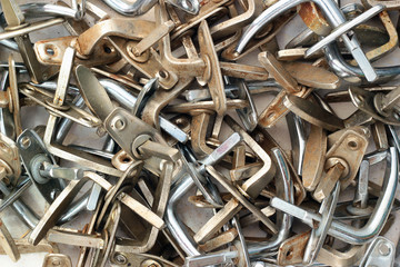 Pile of old dirty metal door handles