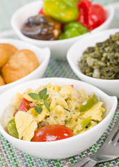 Ackee & Saltfish - Traditional Jamaican dish made of salt cod and ackee fruit. Served with callaloo and johnny cakes.
