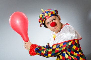 Clown with balloons in funny concept