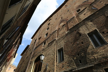 The windows and walls of the old house in the center of a European city