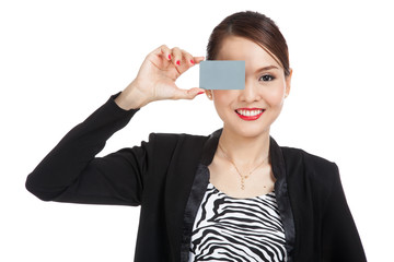 Young Asian business woman with a blank card over her eye