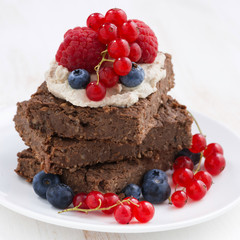 juicy chocolate cake with berries, closeup